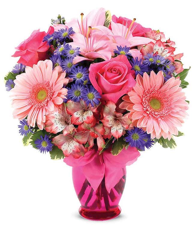 Pink Gerber daisies, pink roses and pink alstroemeria in a pink vase