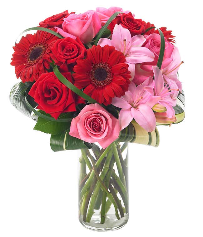 Pink lilies, red gerbera daisies and pink roses