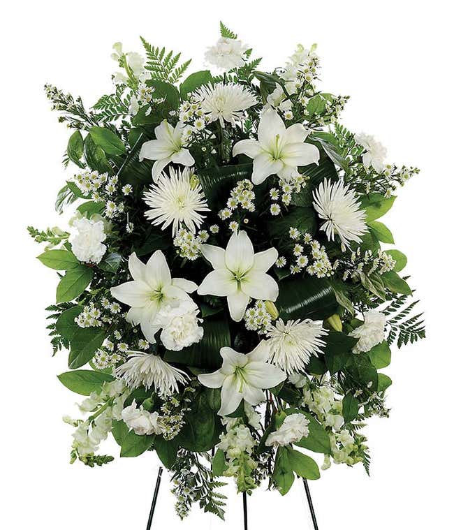 Funeral flowers with white lilies and white mums in standing spray