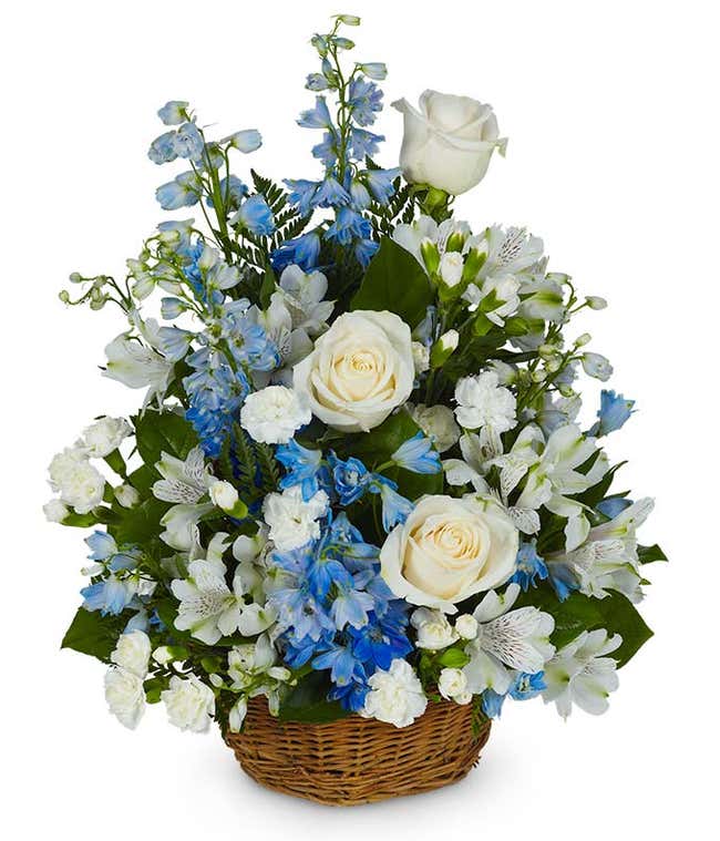 Sympathy floral basket with white roses, carnations and alstroemeria