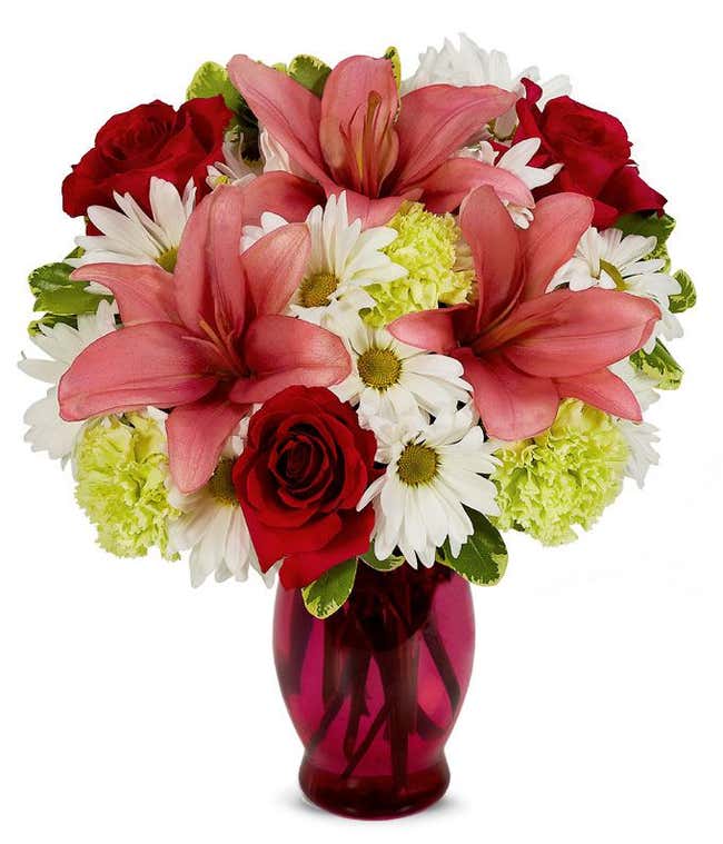 Pink lilies, red roses and white daisies bouquet