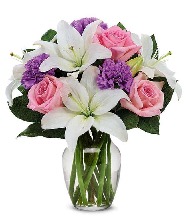 pink roses, purple carnations and white lilies