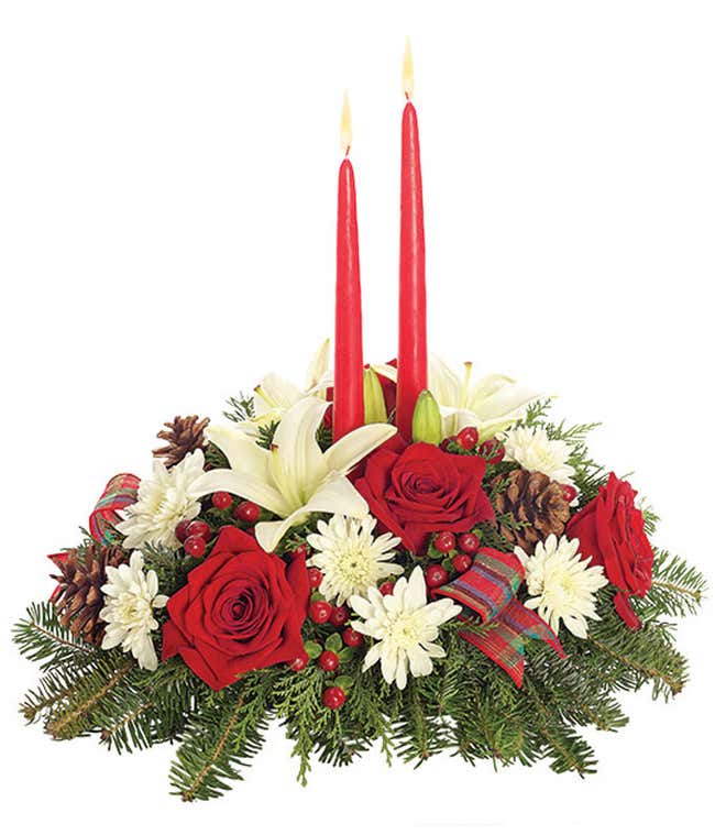Red roses, white lilies, hypericum berries and red candle centerpieces.