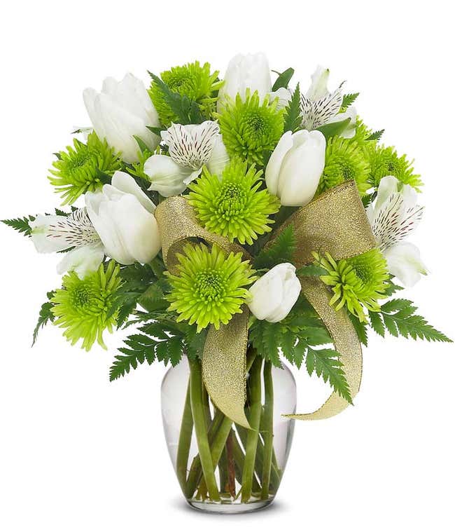 St. Patrick's Day flowers with green mums and tulips in a glass vase