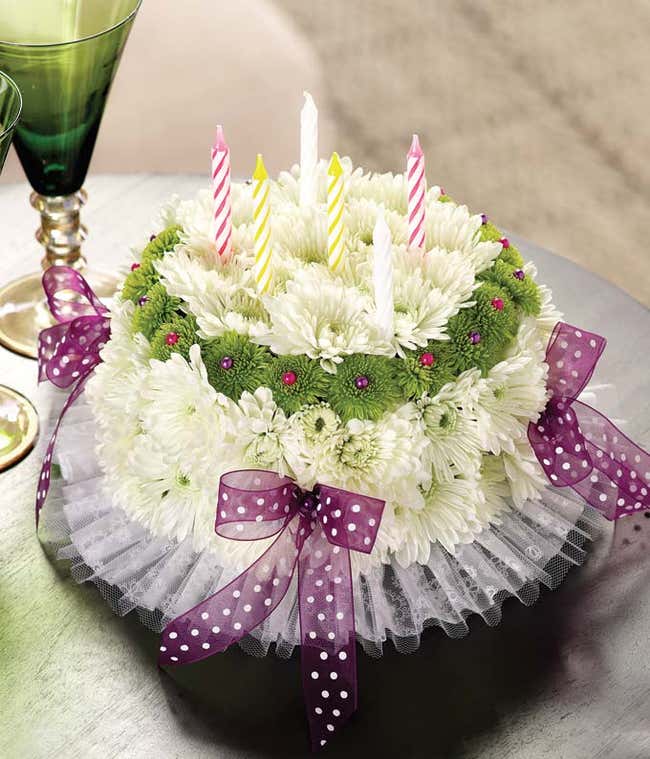 Happy Birthday flower cake with white carnations, green poms and bows