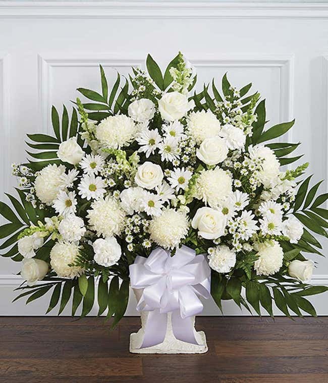 White sympathy basket with white roses and spider mums