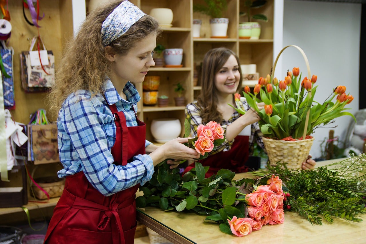 What are florist designed bouquets woman shopping for flowers