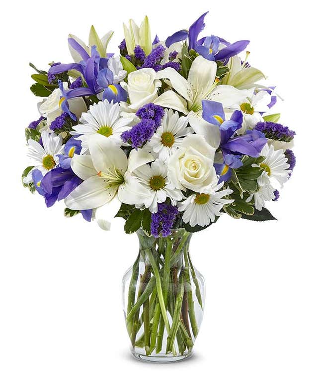 Sympathy bouquet with white roses and blue iris