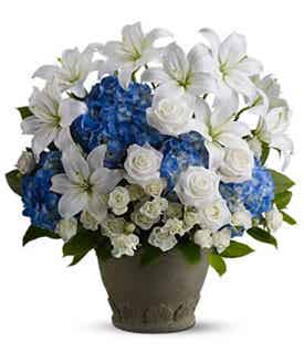 White lilies and blue flowers for sympathy