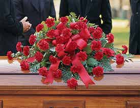 Red floral casket spray